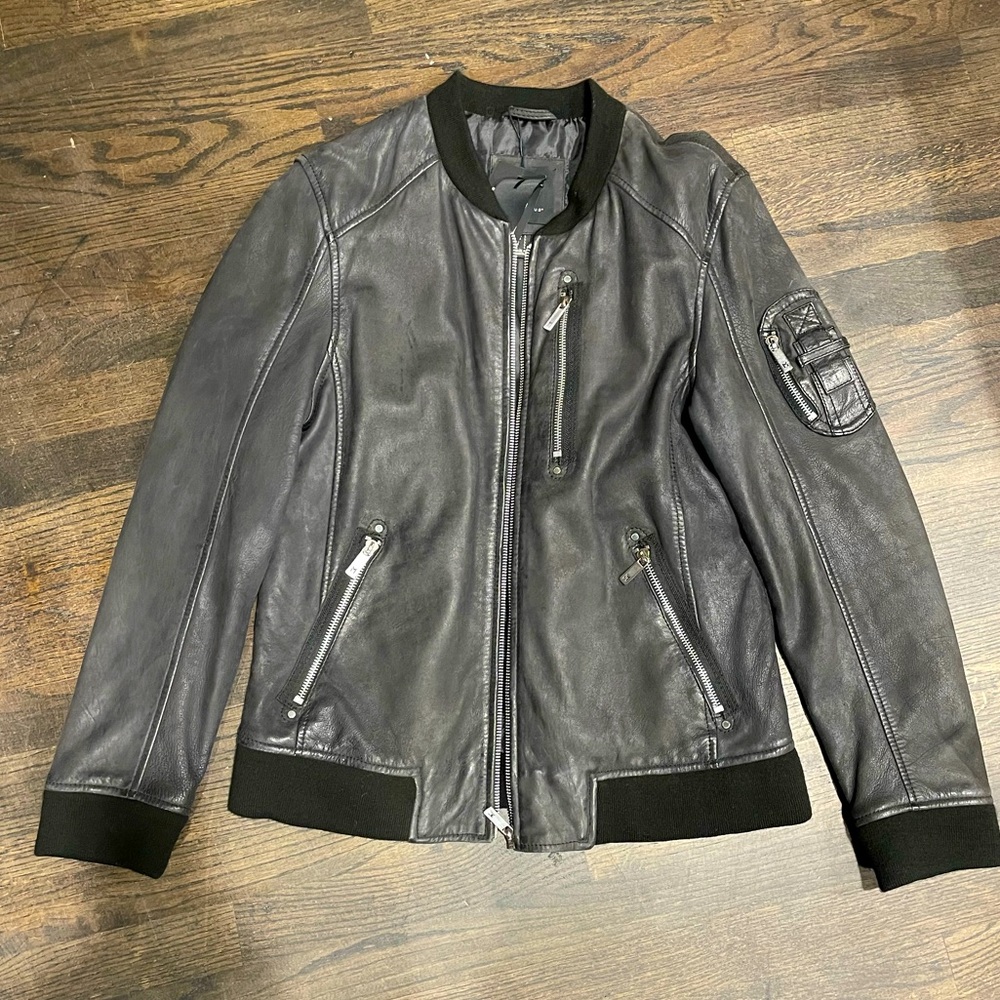 Black slim cut Mauritius lamb skin leather jacket.